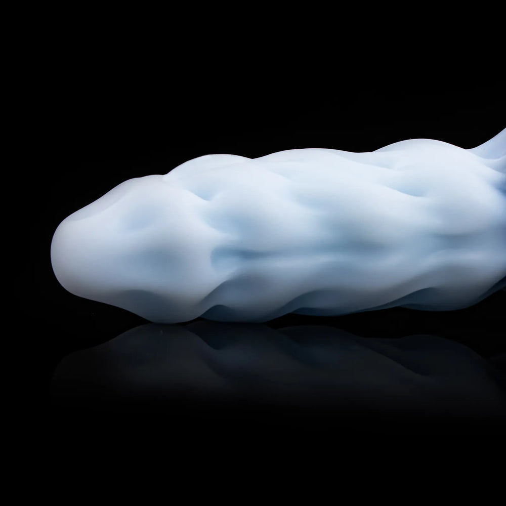 Nivaskel's rounded head and broad ice-blue ridges shown from the side