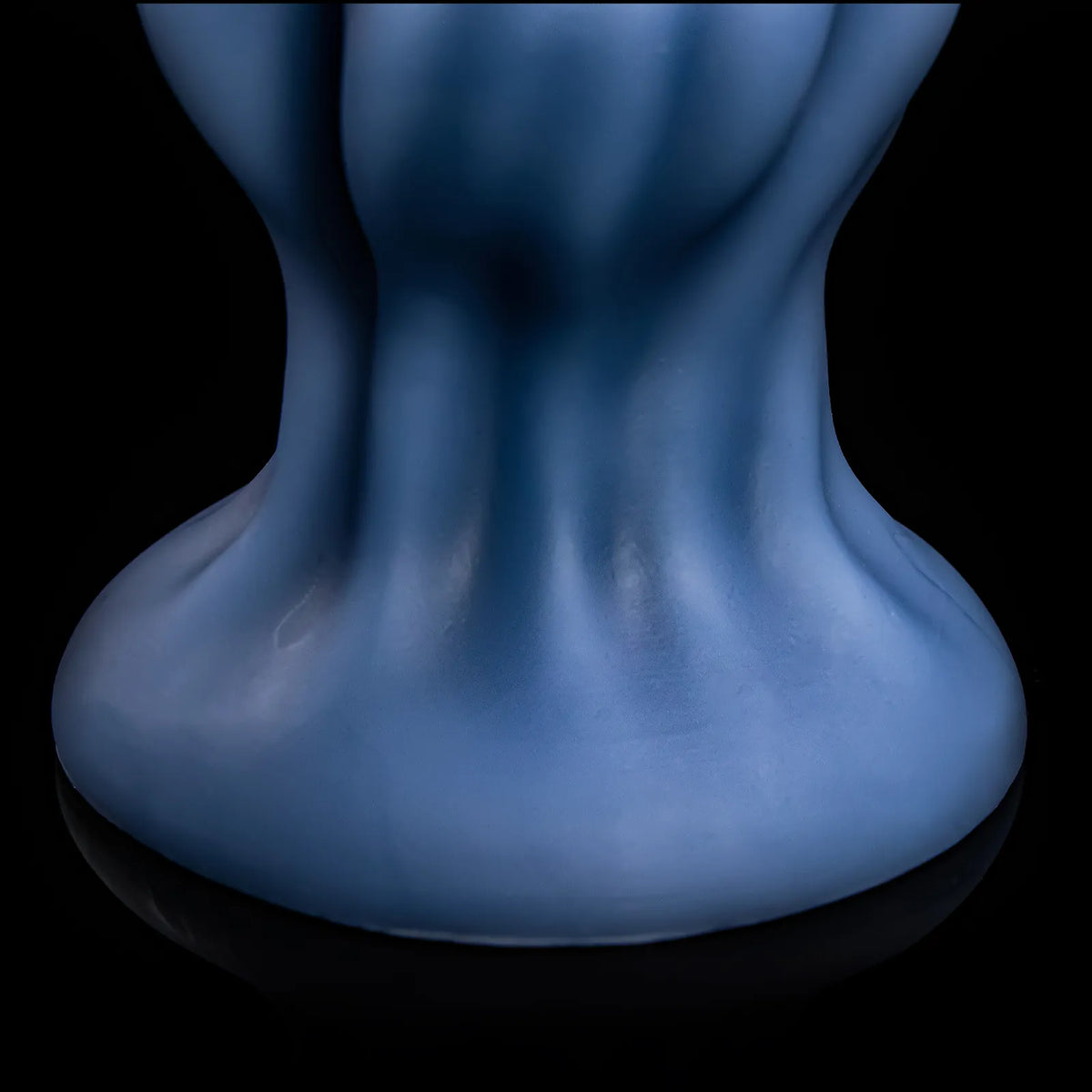 Side view of the blue flared base and narrower neck of Nivaskel.