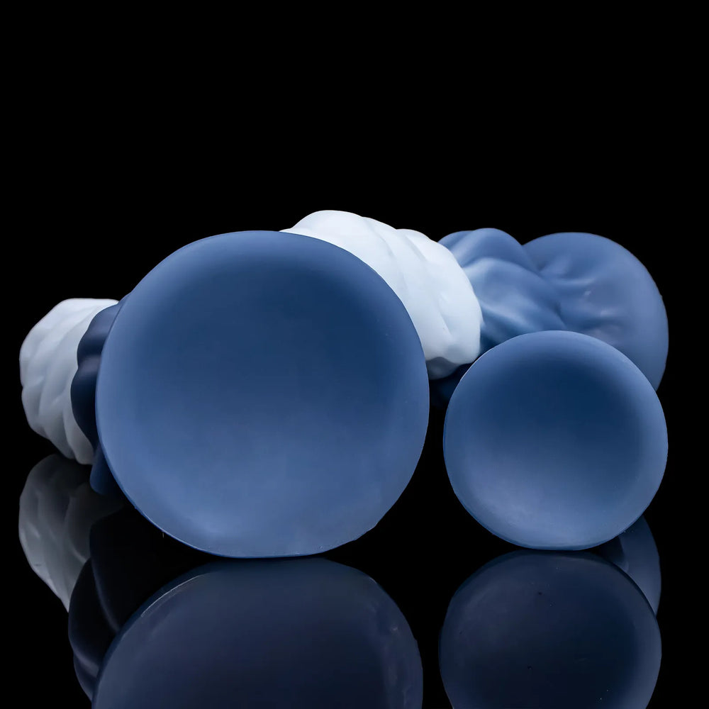 Undersides of two deep sea blue Nivaskel suction-cup bases